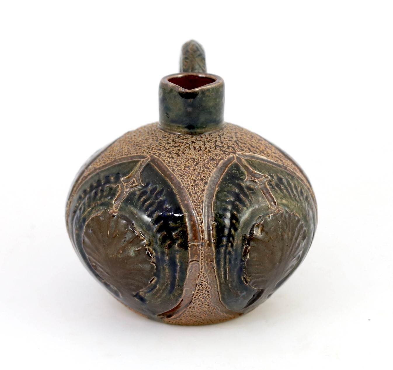 A Martin Brothers stoneware jug, c.1879, 14cm high